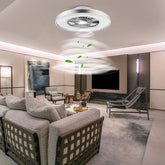 Modern living room with a ceiling fan and decorative elements.